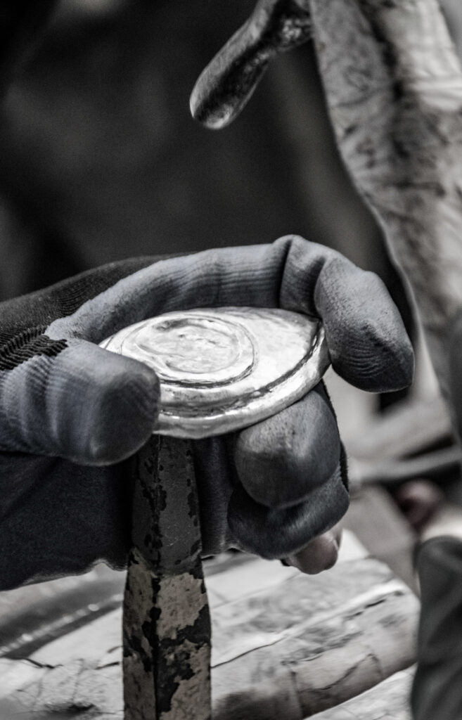 Our master artisans create the "eye" on the feather of the peacock using the repoussé technique